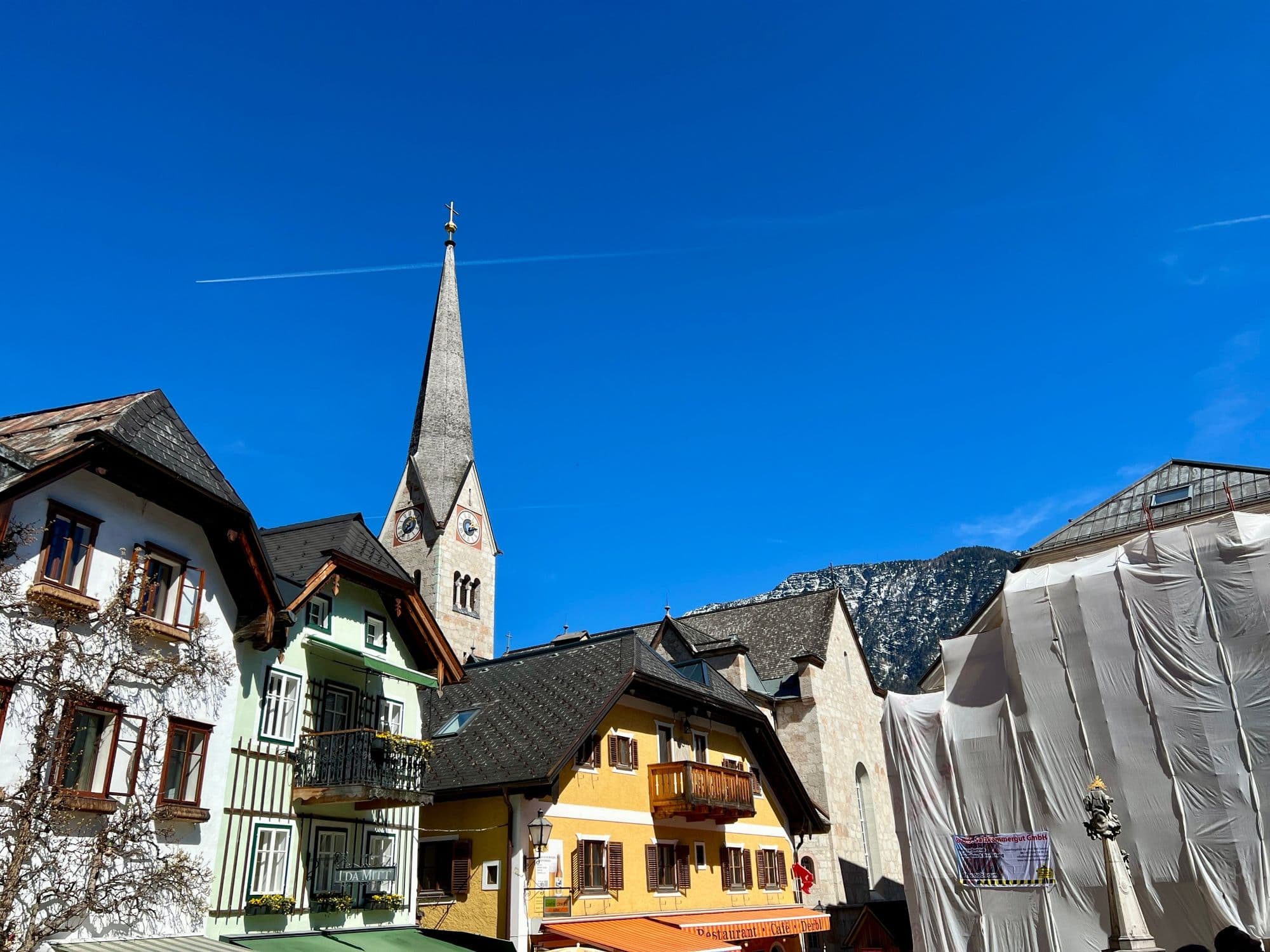 Colourful houses and the church spire in Hallstatt's market square