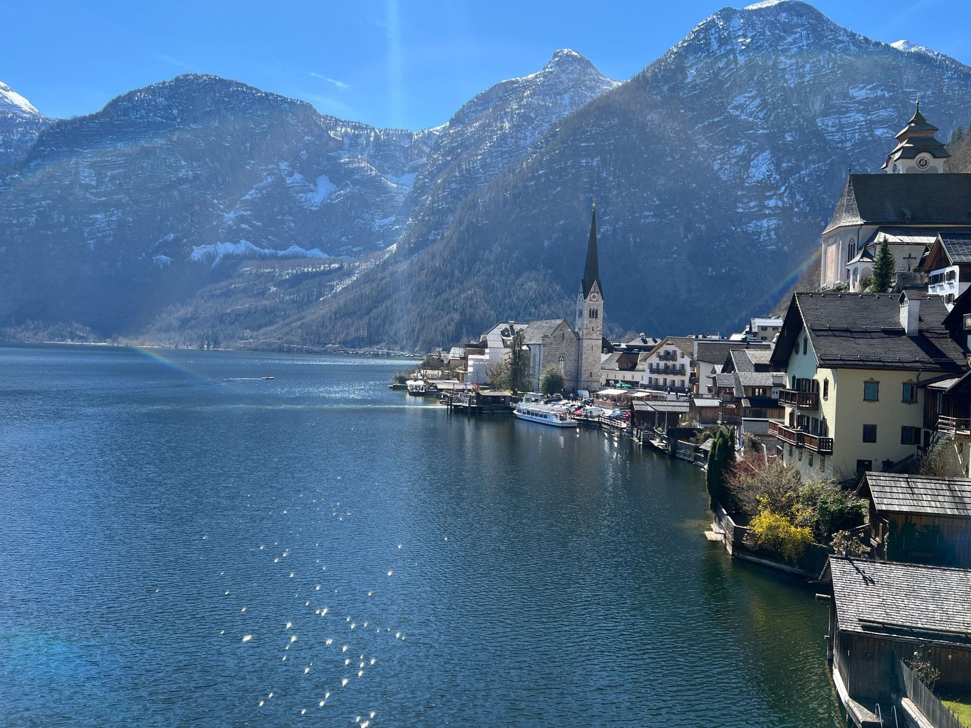 Hallstatt village and church tower along the lake shore