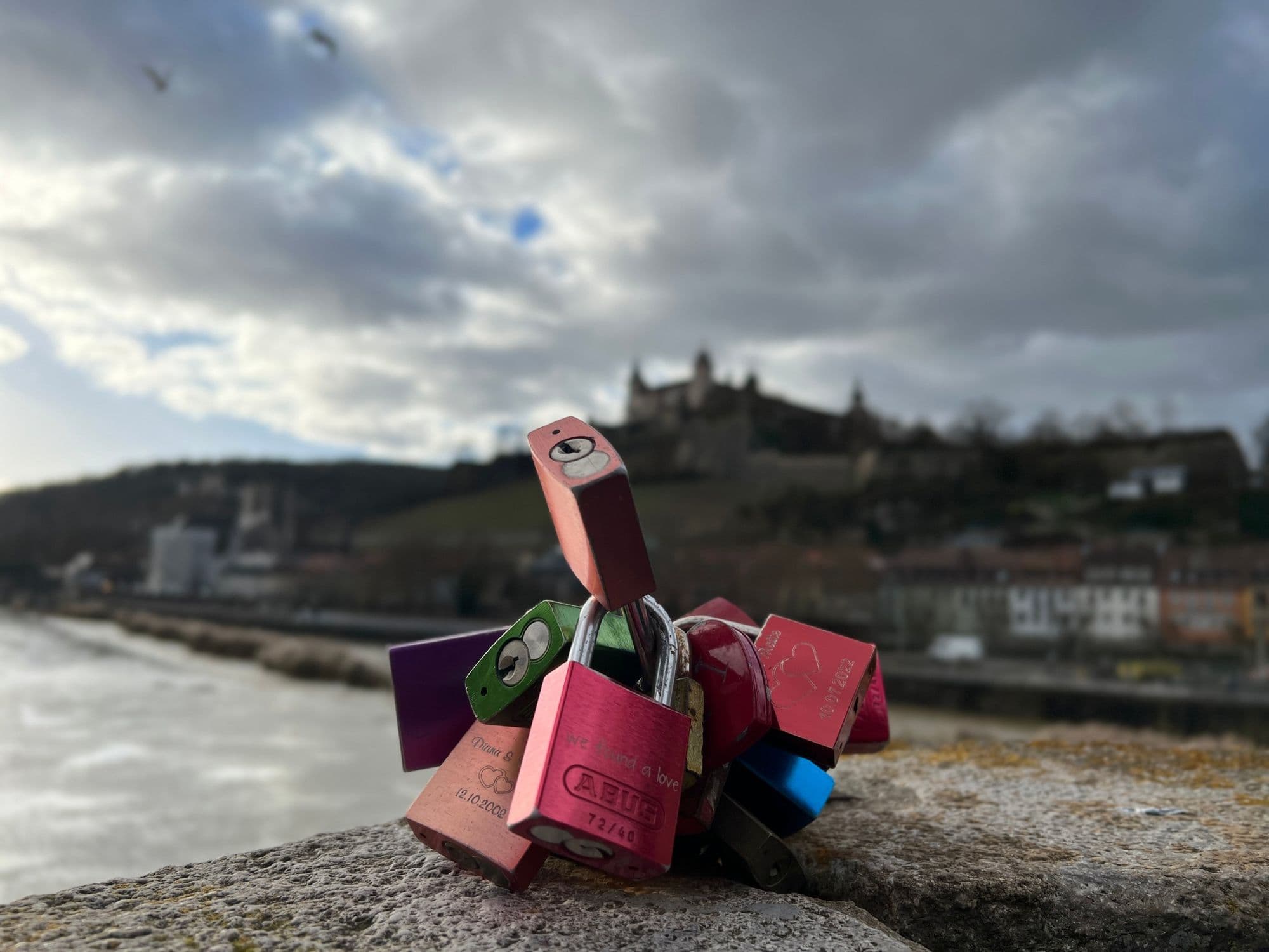 Love locks on the Old Main Bridge with the fortress blurred behind
